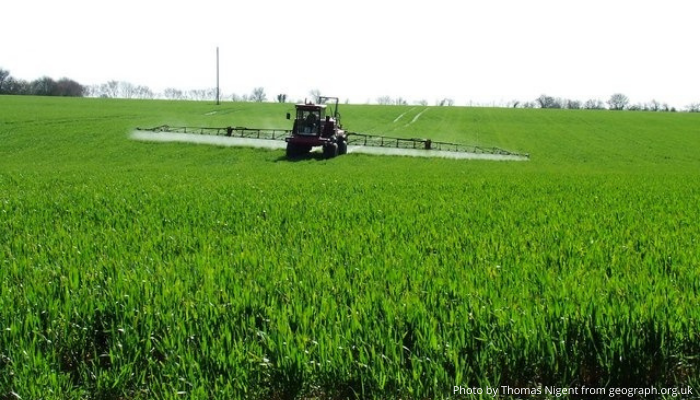 Picture of a field with a chemical sprayer
