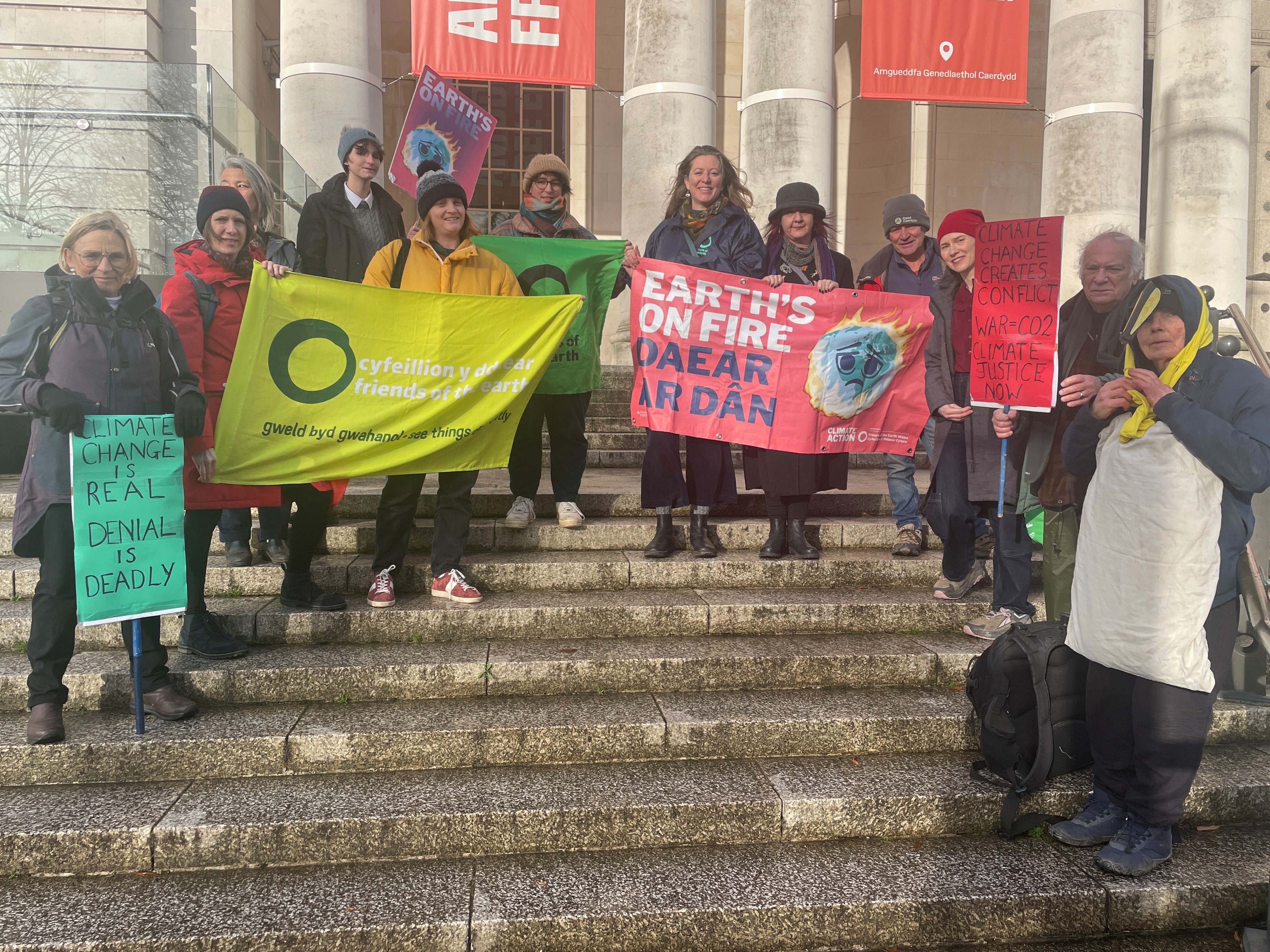 Friends of the Earth groups gather outside the museum in Cardiff before the Global Day of Action