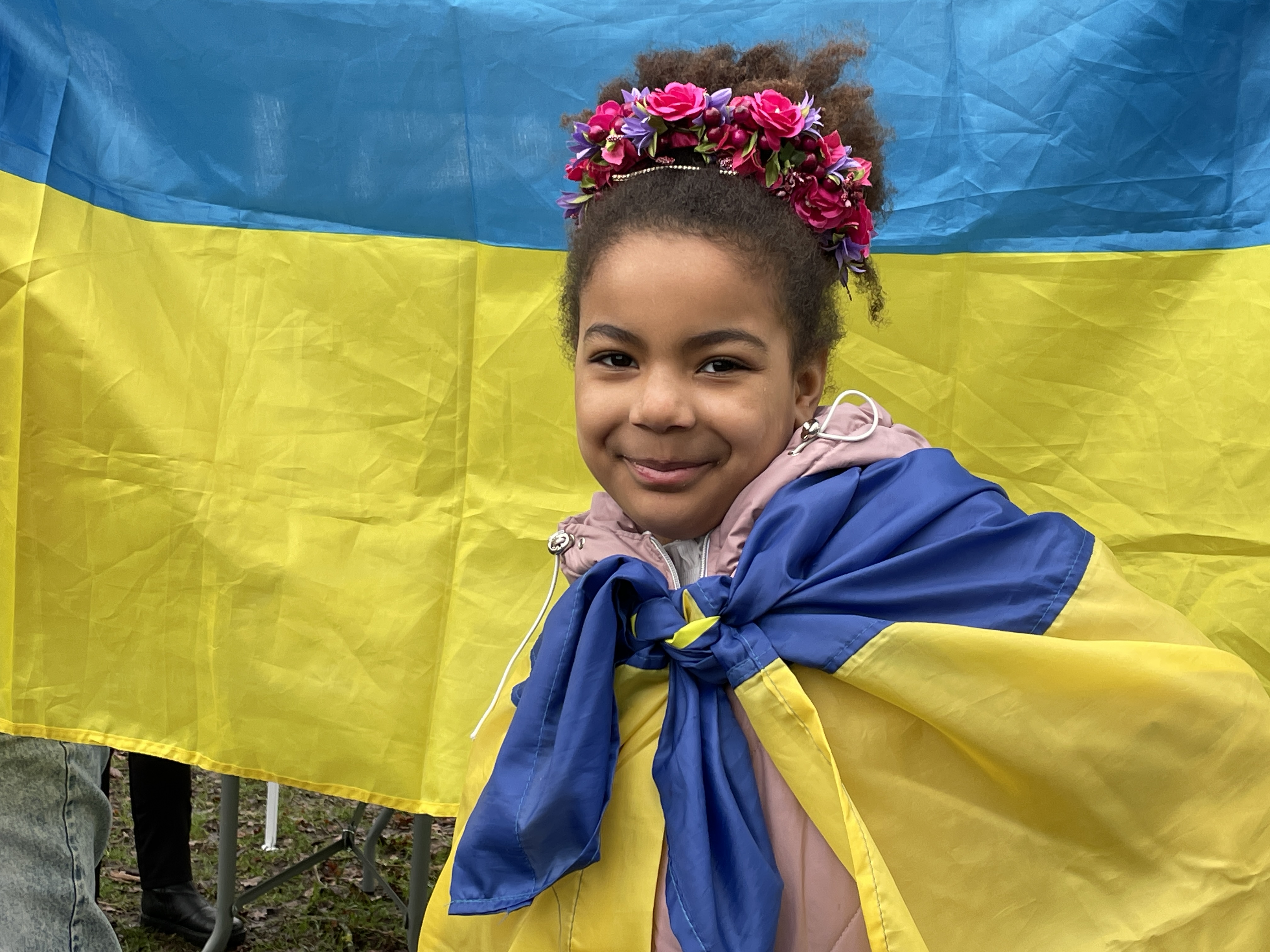 Young black girl wearing Ukrainian flag