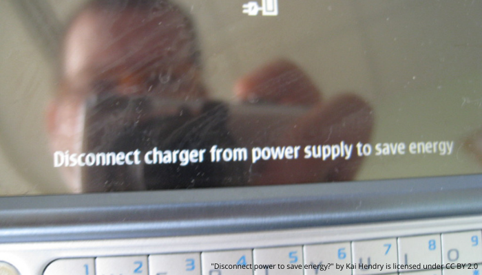 Sign saying disconnect charger to save energy