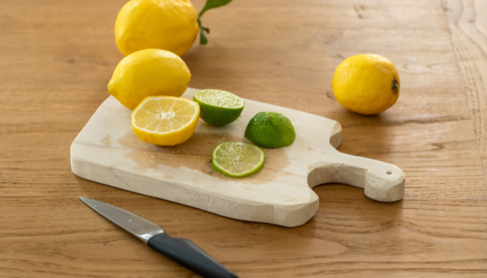 Picture of lemon and limes on a chopping board