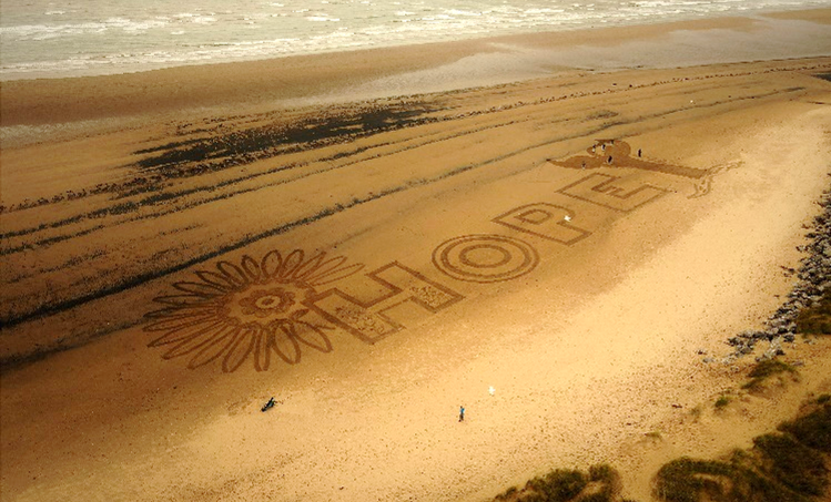 Hope written in sand