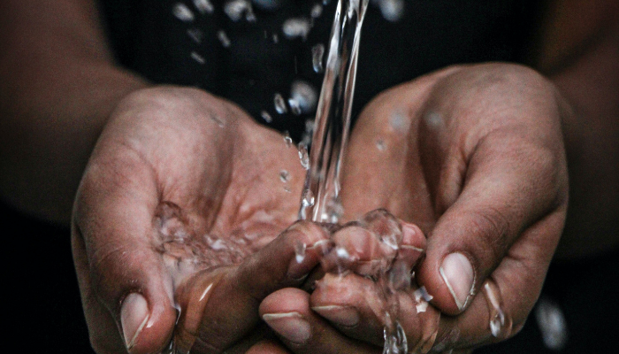 Water running through hands