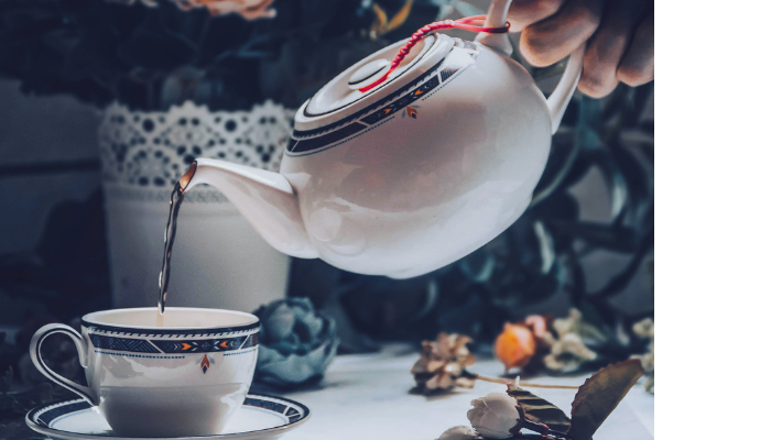 Cup and saucer with tea pot