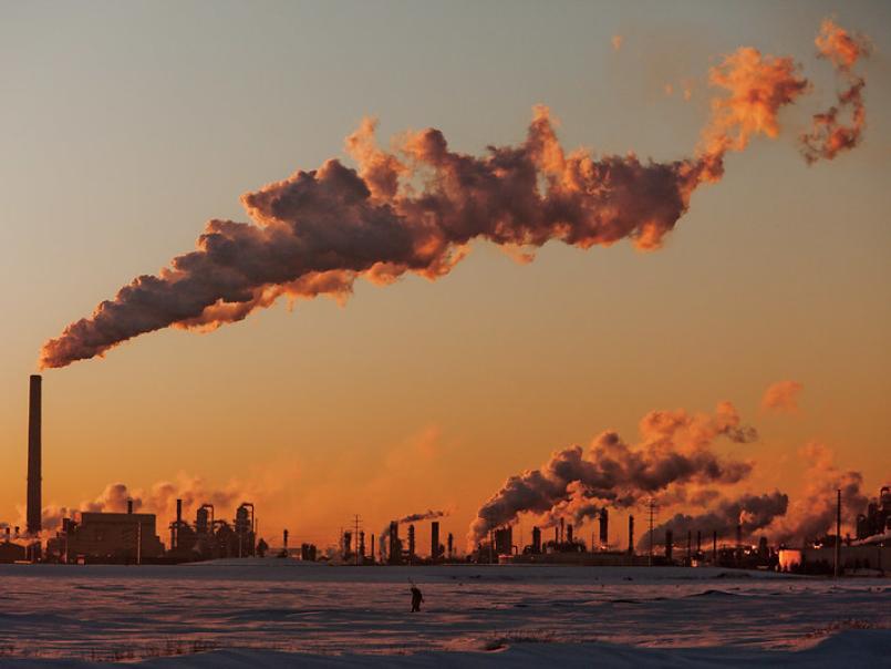 City in the distance with lots of smoking chimneys