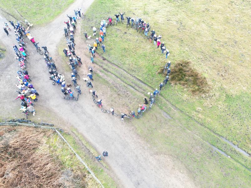 Rally by residents in February - people spelling out no - view from the air