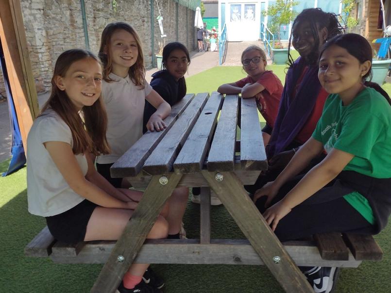 Pupils sitting around a table
