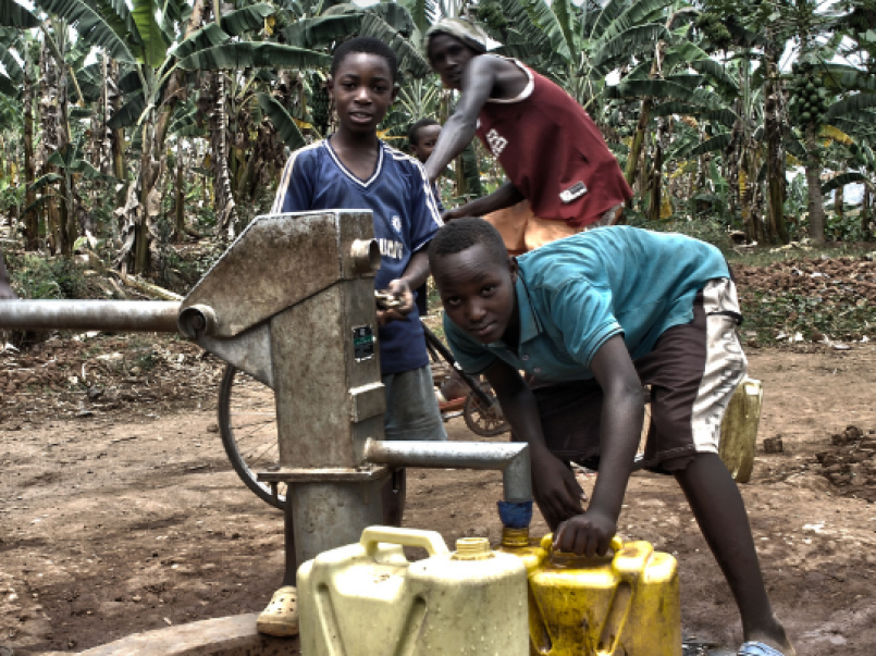Children at a water pump in Africa