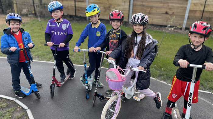 Children arriving at school on bikes