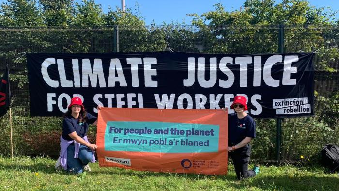 Port Talbot rally - two people holding a sign For People and the Planet